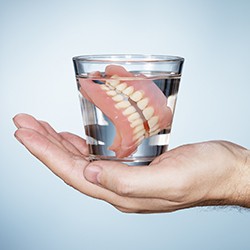 Full dentures in glass of water