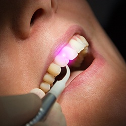 Patient receive laser dental care
