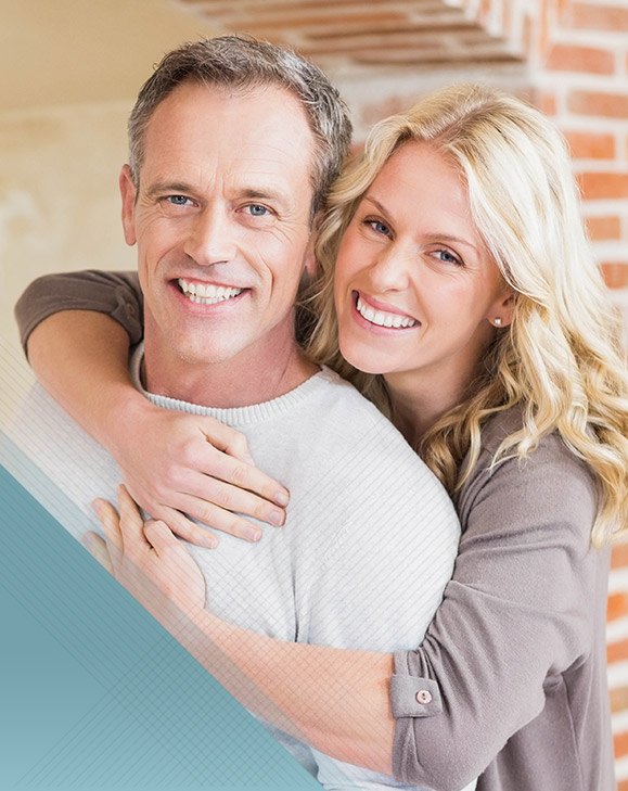 Older man and woman smiling together