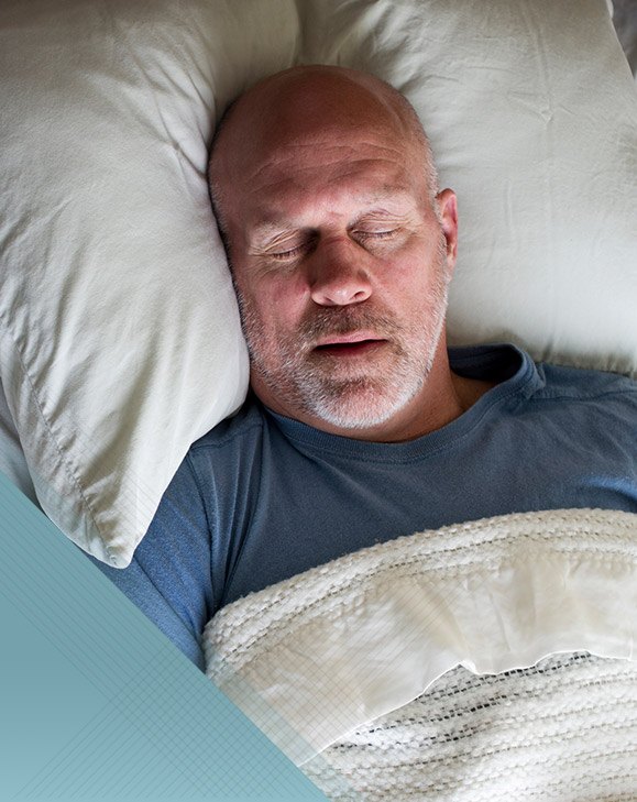 Man sleeping soundly in bed